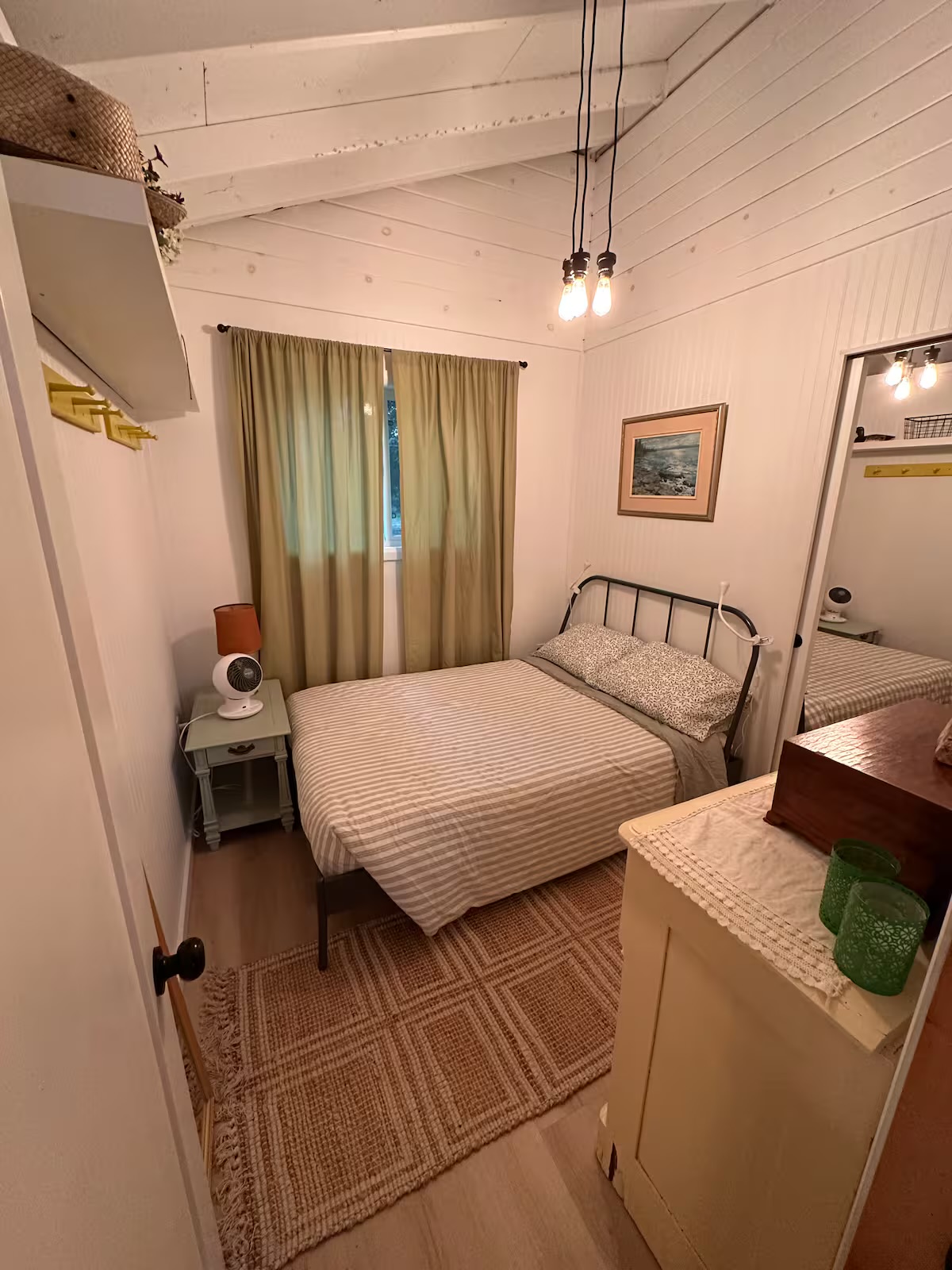 Second double bedroom with warm neutral linens