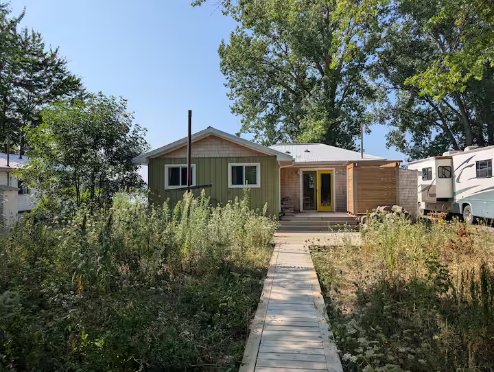 Walleye Cove Cottage and natural meadow from the lane