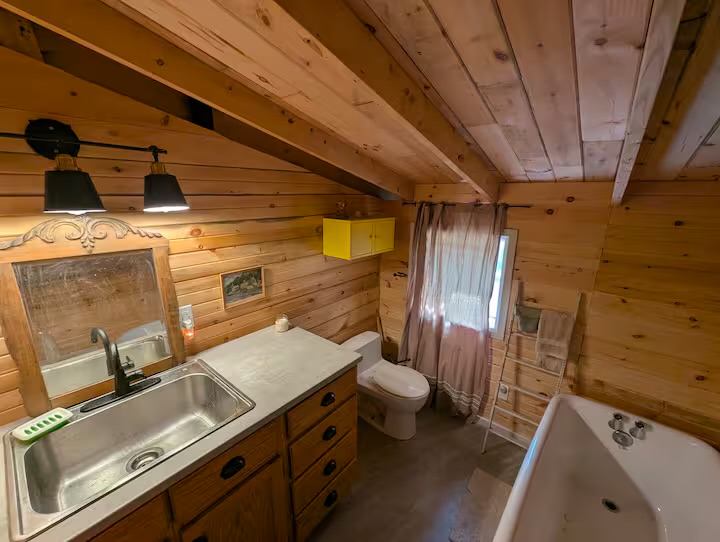 Full bathroom with vanity and soaker tub