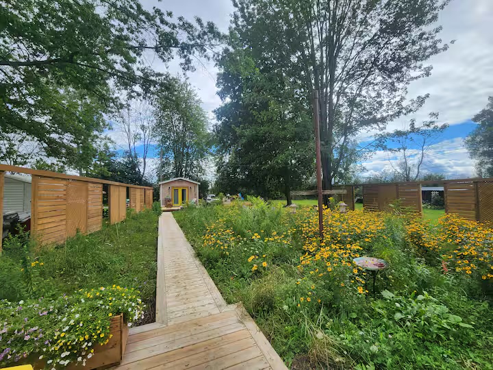 Boardwalk through the natural meadow toward the bunky