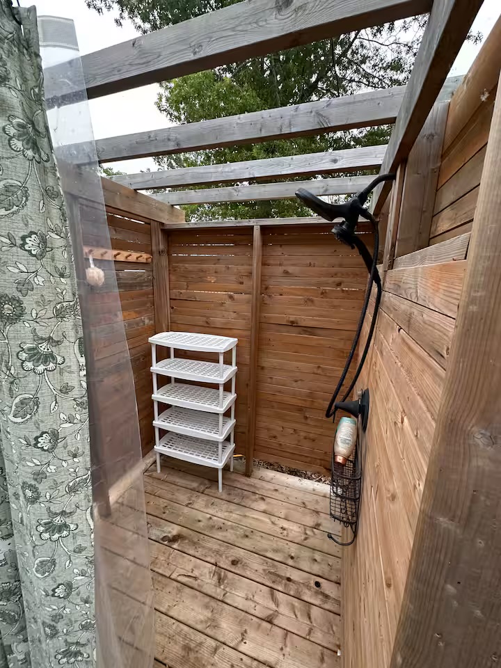 Private wood-screened outdoor shower